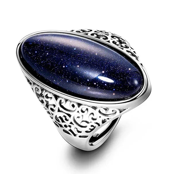 Silver ring with a dark blue gemstone